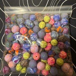 Handmade by me, clay beads. All have holes through them.